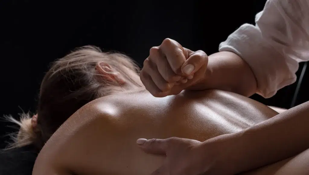 Tantric massage benefits a person holding a hand over a woman's back